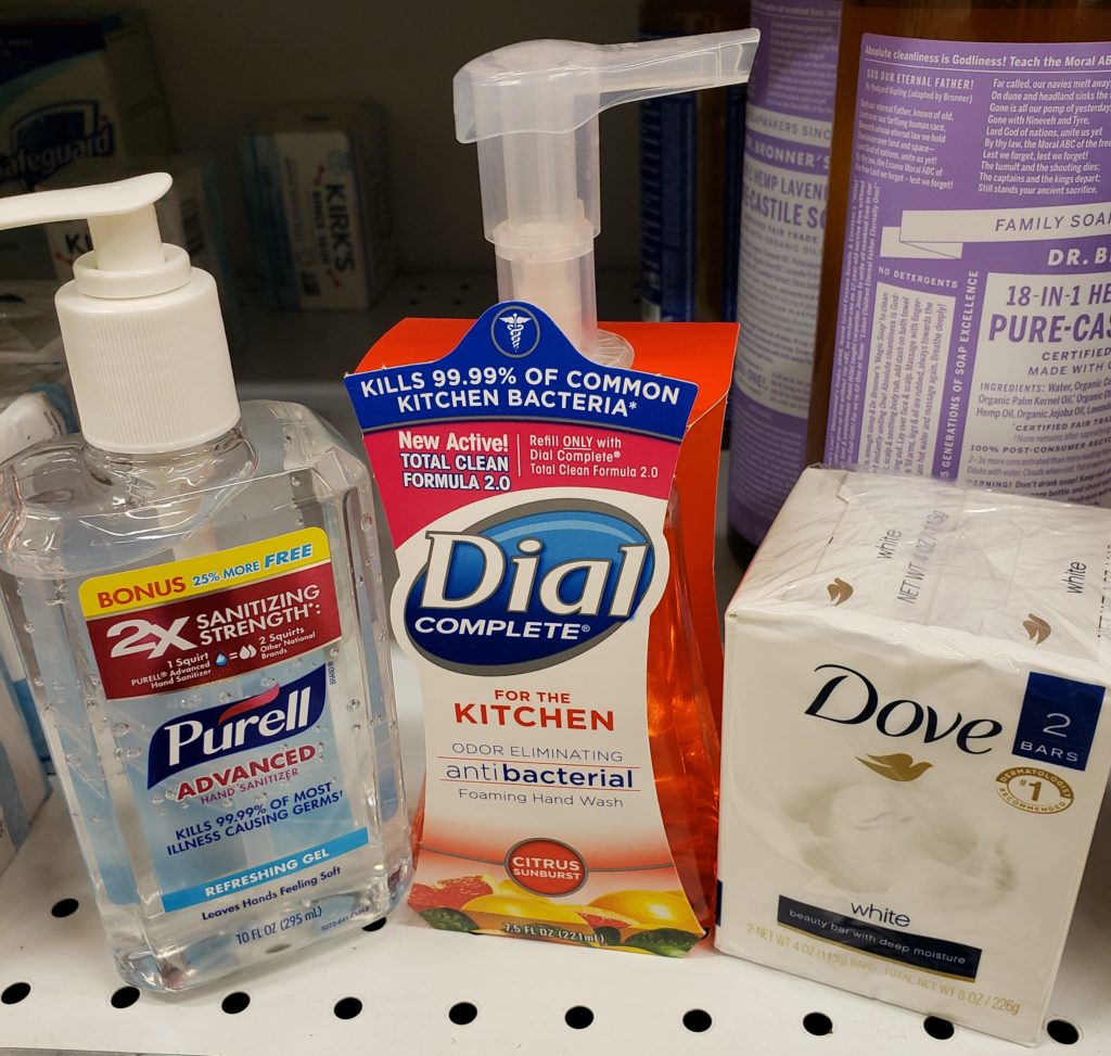 Images of three hand washing agents, including Purell hand sanitizer, Dial antibacterial kitchen soap, and Dove soap bars.