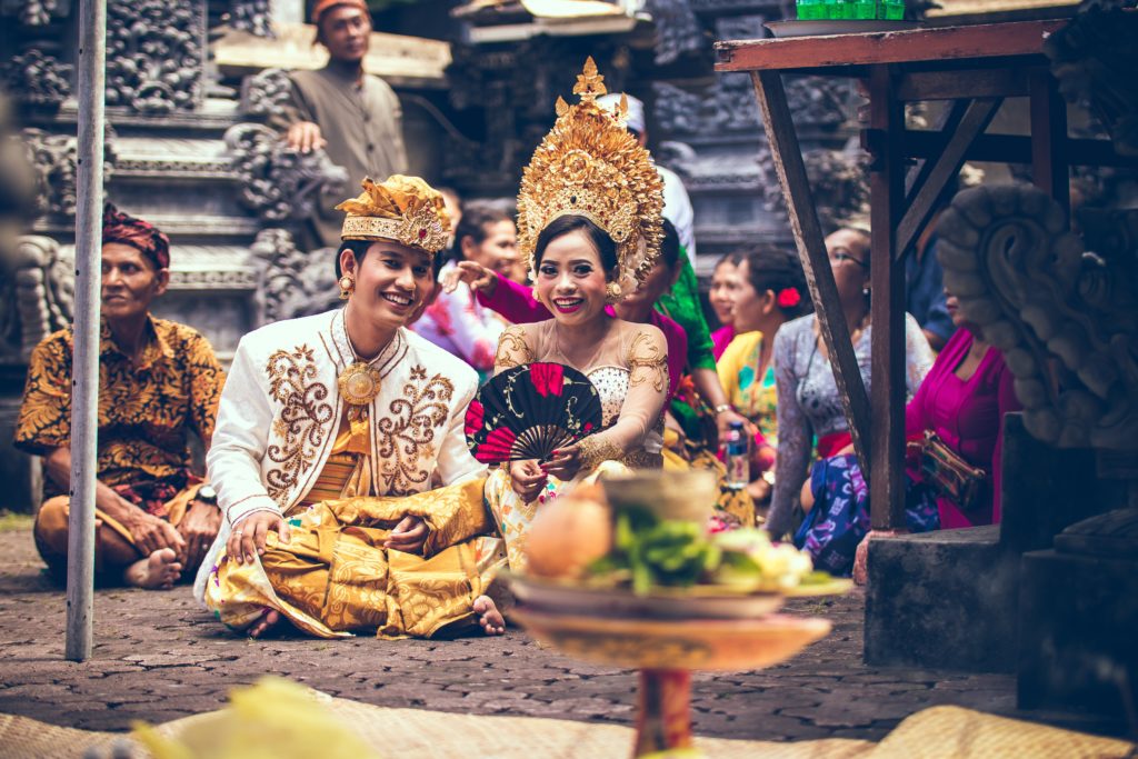 Picture of a wedding in India, meant to refer to the use of weddings for dowries rather than love.