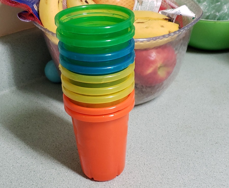 A picture of different colored kid cups. One thing nobody ever tells you about parenting is that cup color is extremely important to kids.