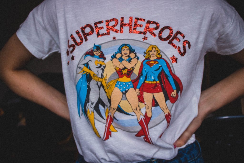 Picture of someone wearing a tshirt with female superheroes on it. 