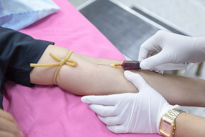 Picture of a woman getting blood drawn.