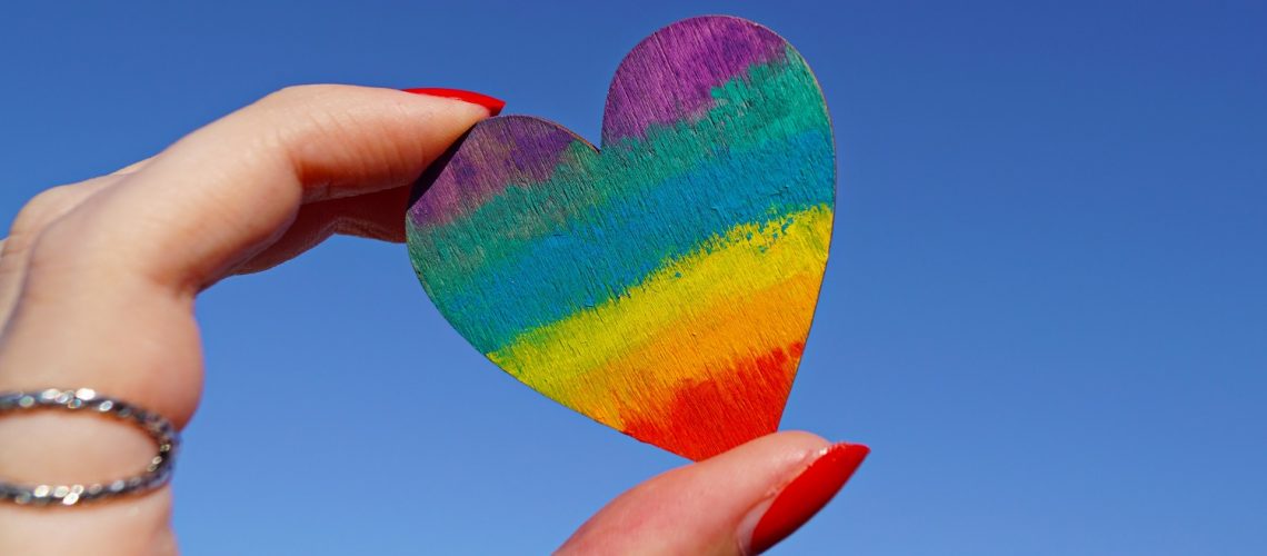 photo-of-person-holding-multicolored-heart-decor-1173576